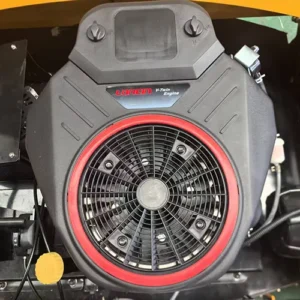 Close-up view of a Loncin V-Twin gasoline engine, featuring a red-ringed cooling fan and branded cover, installed in a machine.