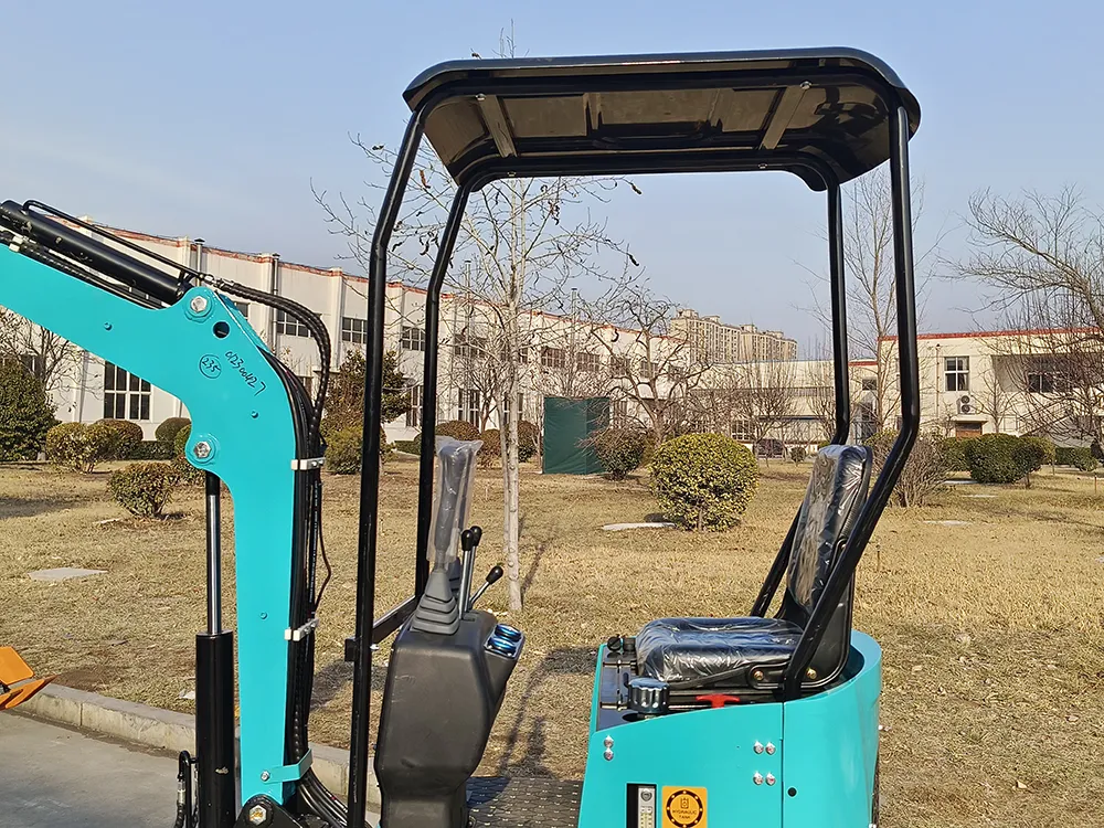 A blue mini excavator cabin with an open canopy, operator seat, and dual joysticks, against a factory and park background.
