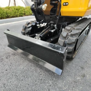 Front view of a heavy-duty black dozer blade attached to a yellow mini excavator.