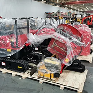 Red construction equipment securely wrapped and strapped on a wooden pallet, ready for shipment.