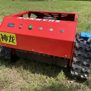 Front view of a red SHANNON Shenlong tracked lawn mower with control panel, positioned on a grass field.