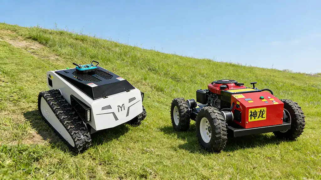 Side-by-side comparison of a white tracked remote lawn mower and a red wheeled "Shenlong" remote mower, operating on a steep green hillside under a clear blue sky.