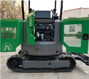 Rear view of green-gray mini excavator with open engine compartment doors showing internal components