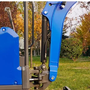 Close-up of mini excavator boom hydraulic cylinder and pivot joint with blue metal arm