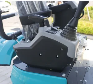 Close-up of dual joystick control assembly on mini excavator with switches and levers