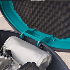 Close-up of noise-reducing foam insulation in mini excavator engine compartment
