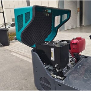 Open view of mini excavator engine compartment showing hydraulic tank, fuel tank and noise insulation