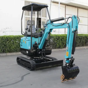 Side front view of turquoise mini excavator model 18 with bucket, dozer blade and operator canopy