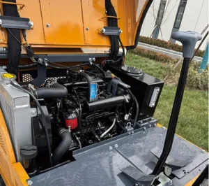 Open engine compartment of yellow mini excavator showing engine, radiator and filters