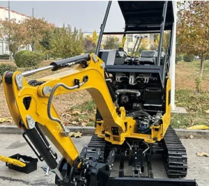 Open view of yellow mini excavator showing engine compartment, boom and tracked undercarriage