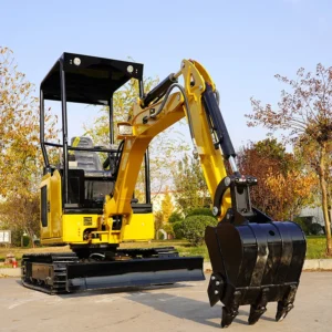 Side front view of yellow mini excavator with open canopy, metal tracks, bucket and dozer blade