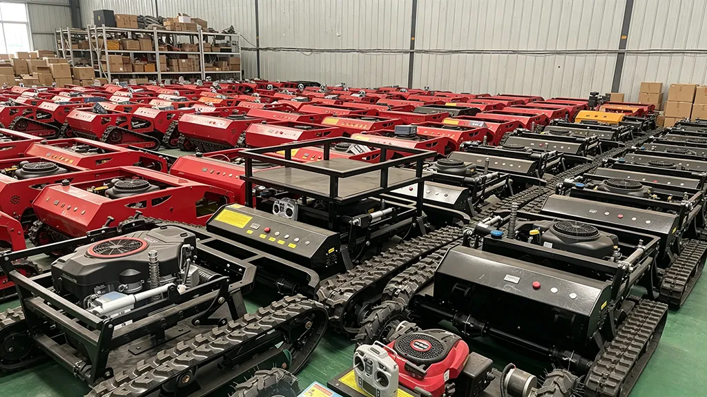 Rows of red and black remote-controlled tracked lawn mowers stored in a factory warehouse, ready for shipment worldwide