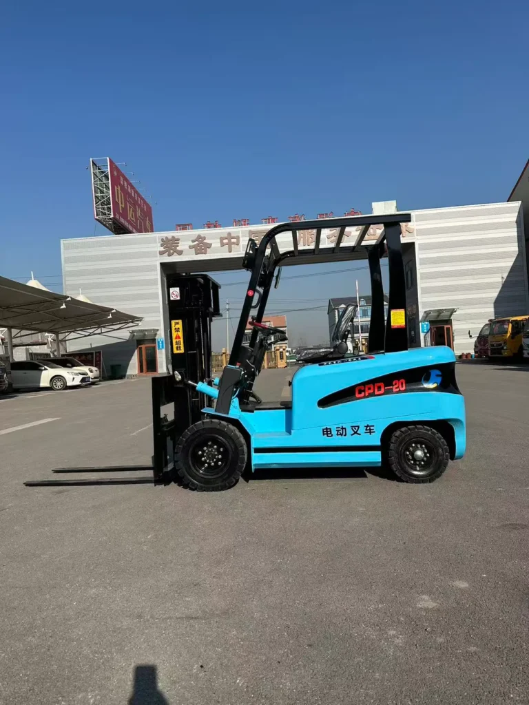 Light blue CPD-20 2 ton electric counterbalance forklift parked on factory yard, zero emission for indoor warehouse cargo handling